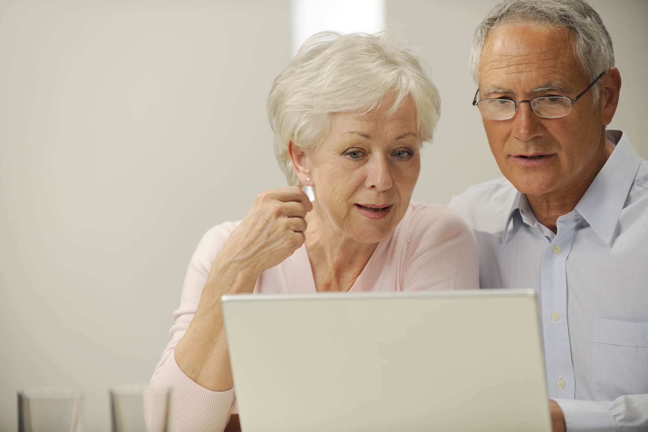 Senior couple using laptop